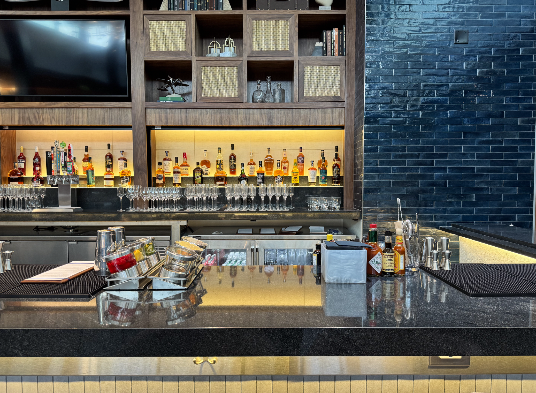 Selection of whiskeys at the bar in Amex ATL lounge