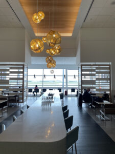 Some of the seating options at the Flagship Lounge, including long tables, shorter tables, and tarmac side tables