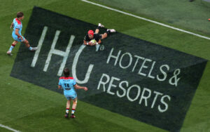 Rugby try on pitch with IHG brand name on the grass