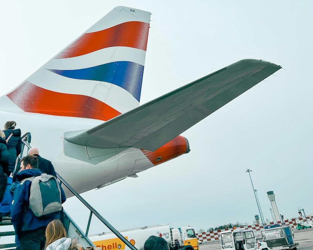 People boarding a British Airways plane through the rear door