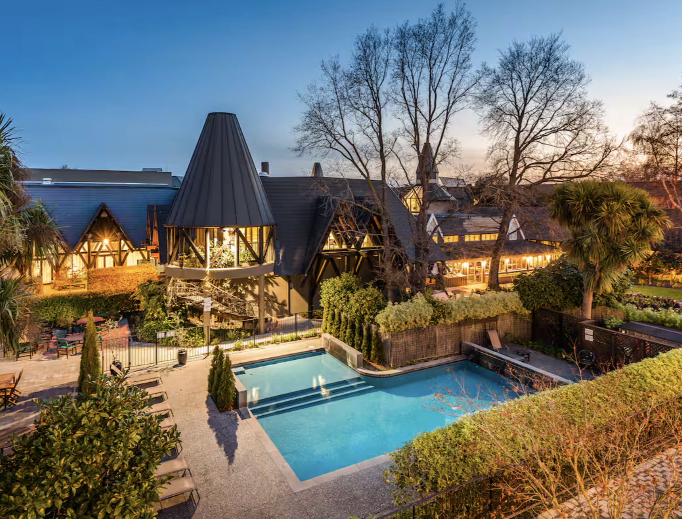 Exterior view of the pool at nighttime of the Chateau on the Park - Christchurch, a DoubleTree by Hilton