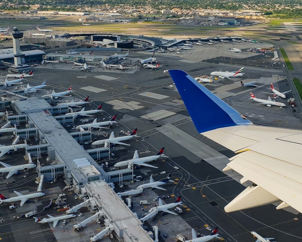 View of JFK airport from the wing of en E175.