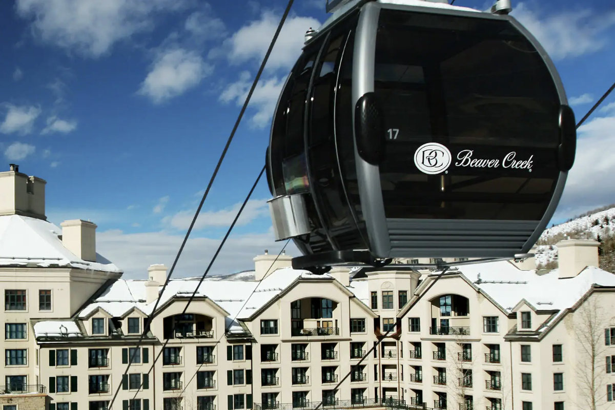 View of a Gondola and exterior of the Park Hyatt Beaver Creek Resort and Spa.