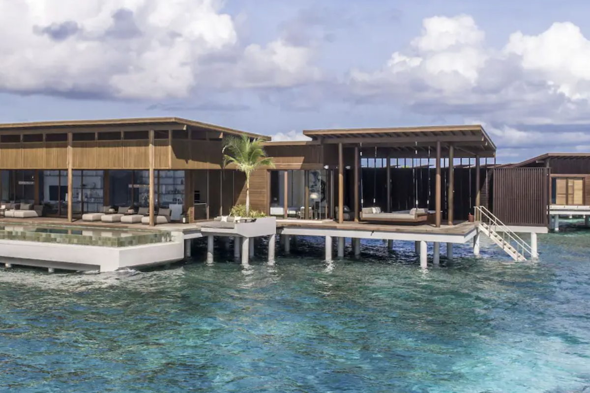 Aerial view of an over-water bungalow at Park Hyatt Maldives Hadahaa