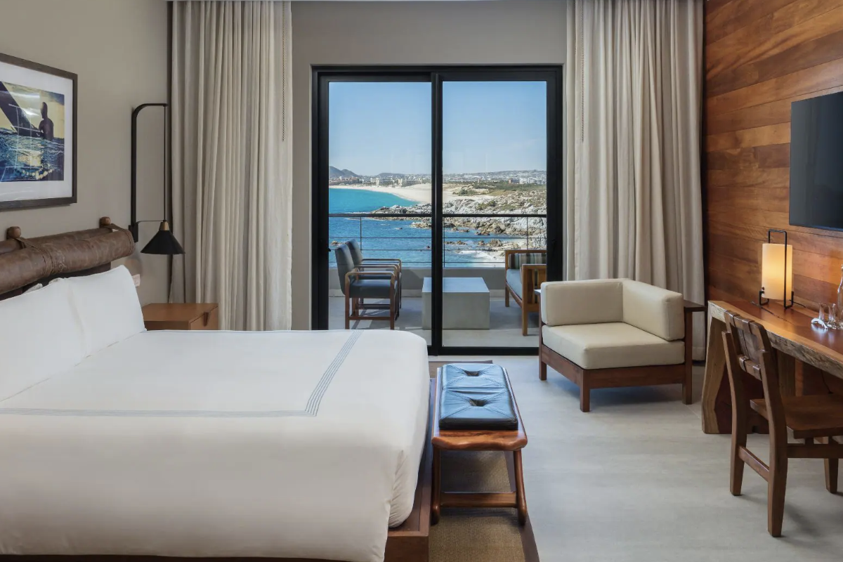Room and window view of a suite at The Cape, a Thompson Hotel.