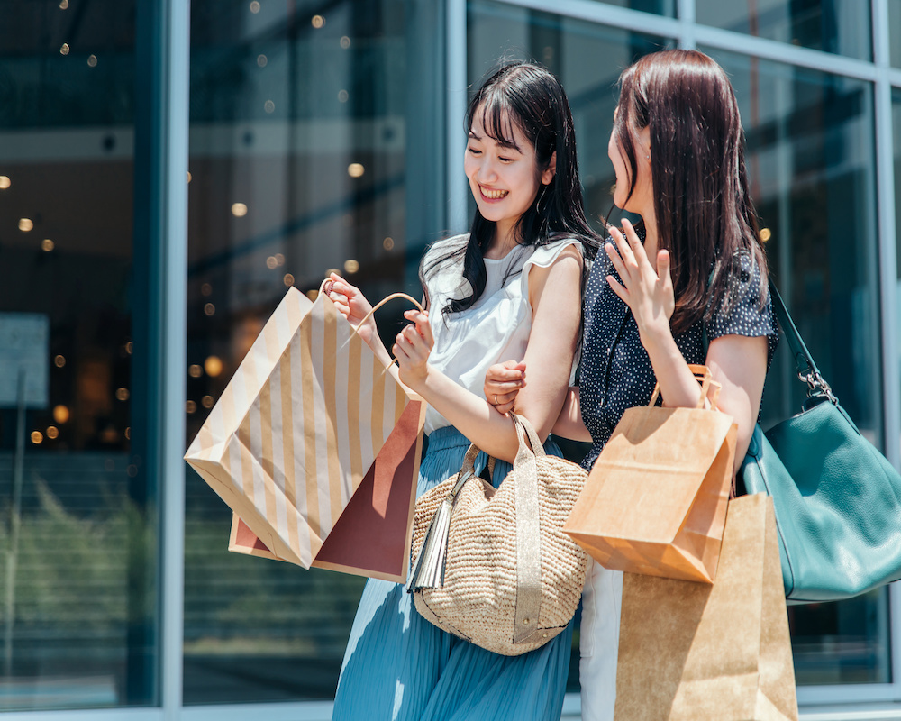 2 women shopping happily