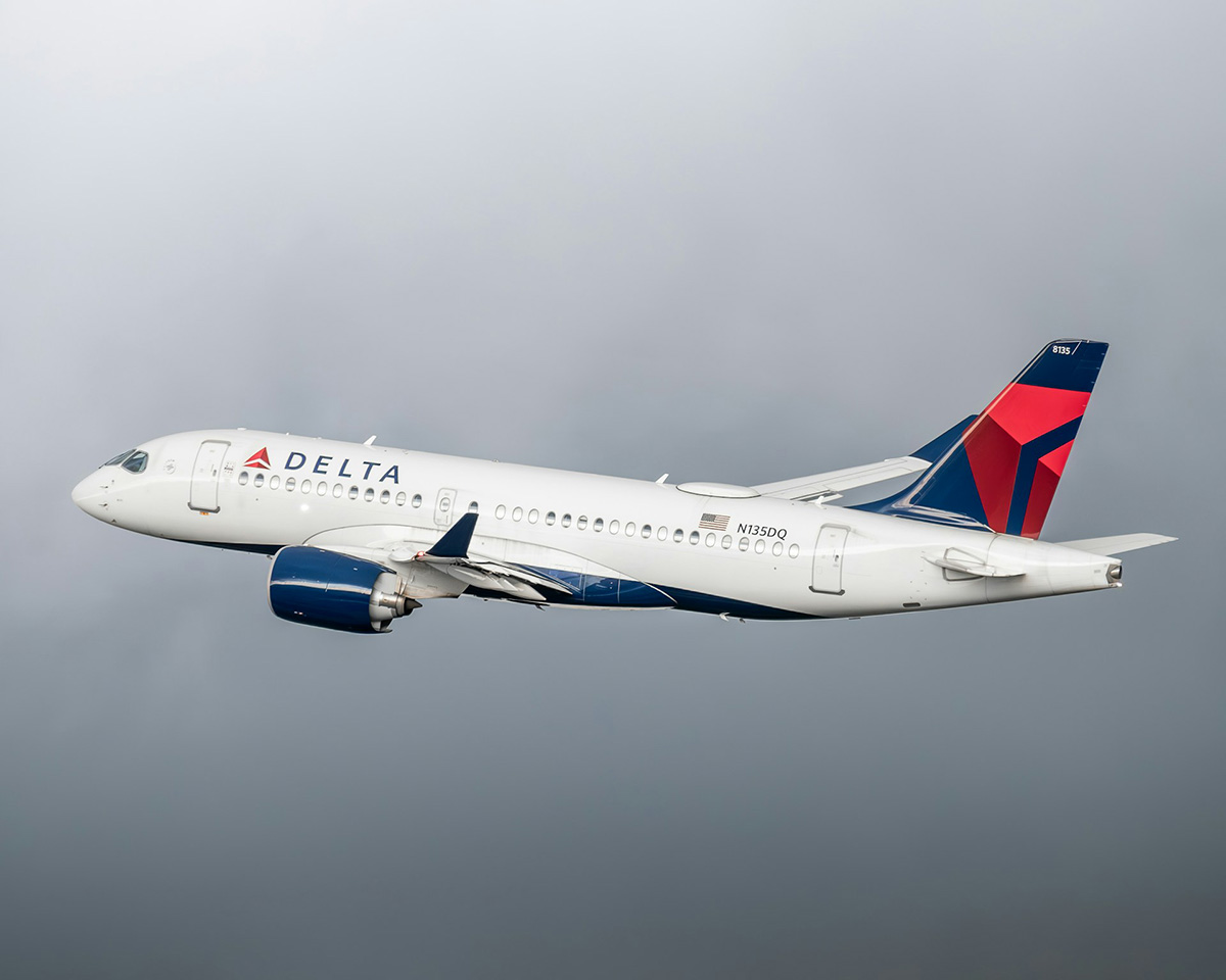 Delta Airlines Aircraft inflight against a grey sky