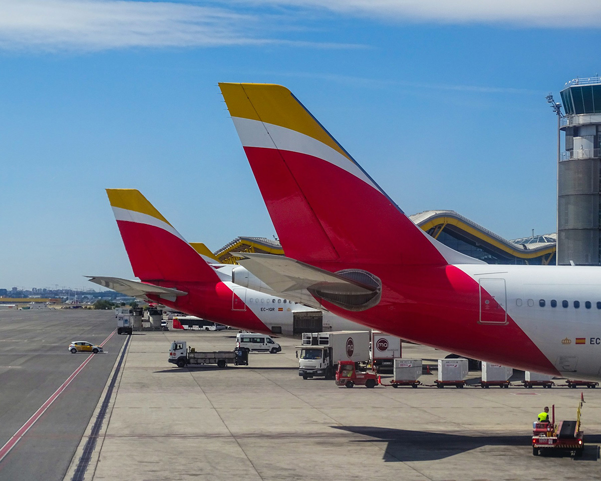 Featured- Iberia Aircraft tailfins at the gates