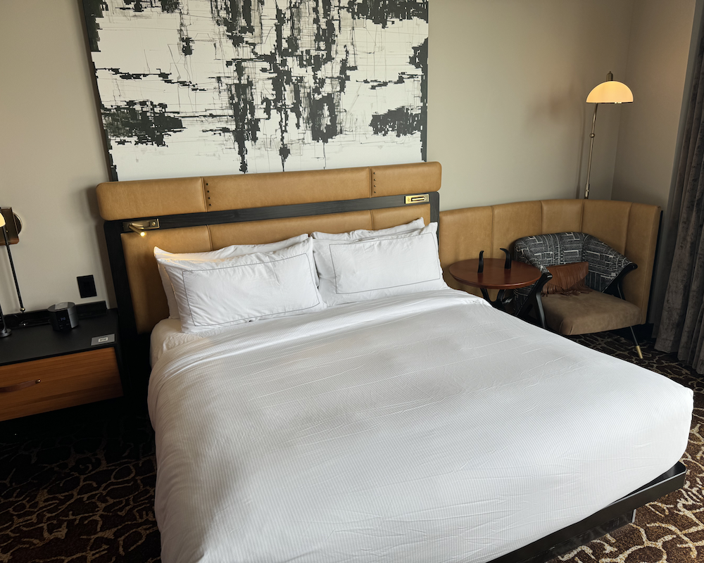 a hotel bedroom with king-size bed