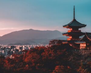 Japanese sunset with a pagoda in the background.