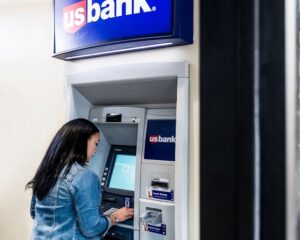 a woman using a U.S. Bank ATM