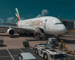 Emirates A380 parked at a gate in AMS.
