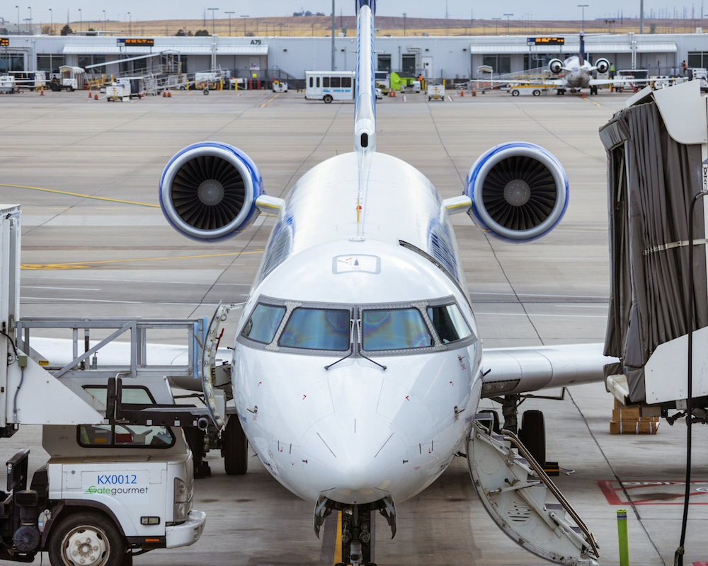 United CRJ parked at a gate.