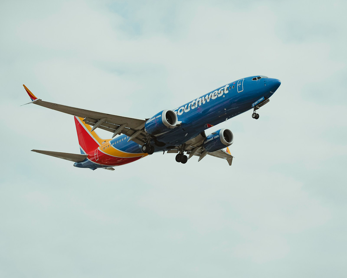 Southwest Airlines jet in flight with the wheels down