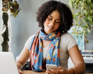 Photo of a young woman checking her phone