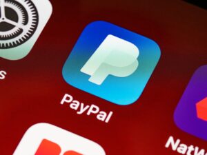 Phone screen with PayPal app icon