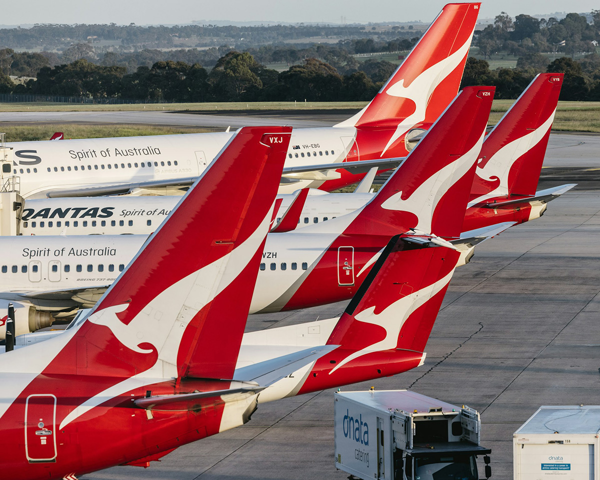 Collection of Qantas aircraft tail fins at the gate