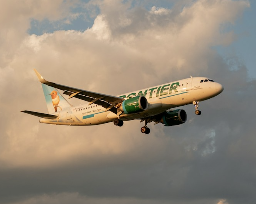 Frontier Airlines plane landing at DCA Airport.