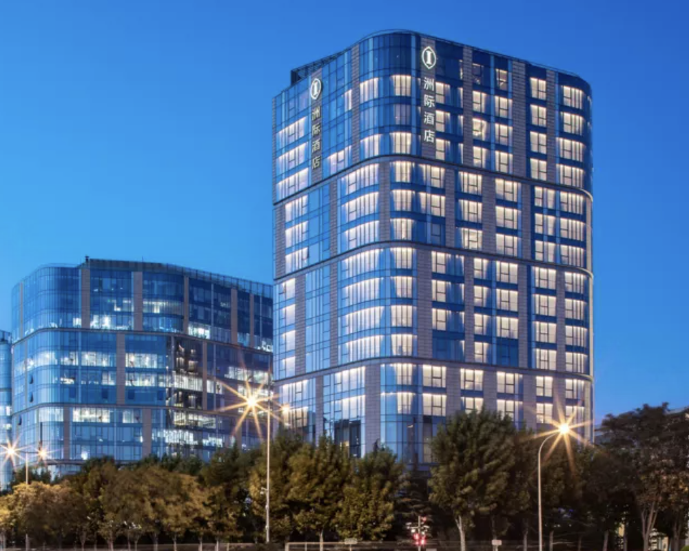 Exterior of the InterContinental Beijing Beichen at dusk.