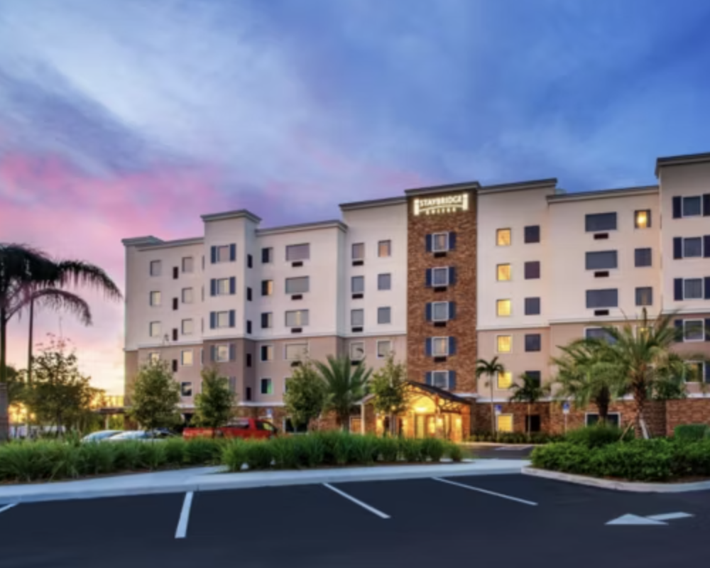 Exterior of the Staybridge Suites Fort Lauderdale Airport - West at sunset.