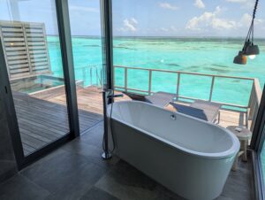 Overwater villa bathtub at the Le Meridien Maldives