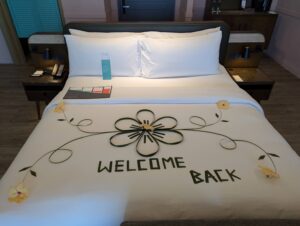 Welcome back massage on our bed at the Le Meridien Maldives