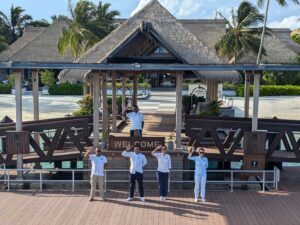 Waldorf Astoria Maldives staff greeting our yacht