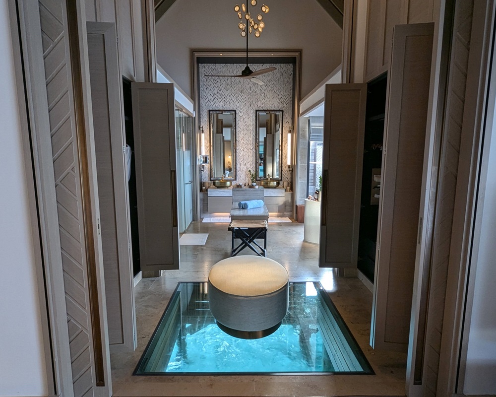 Glass botton floor in an overwater villa at the Waldorf Astoria Maldives