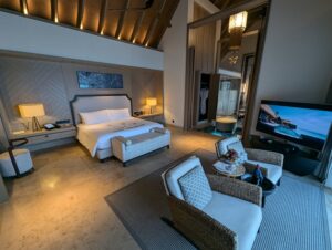 Bedroom in an overwater villa at the Waldorf Astoria Maldives