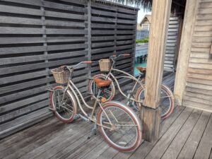 Bikes inside a villa gate at the Waldorf Astoria Maldives