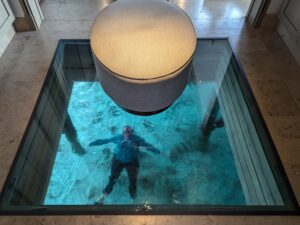 Katie swimming under our villa at the Waldorf Astoria Maldives