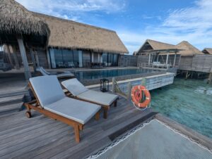 Pool deck for an overwater villa at the Waldorf Astoria Maldives