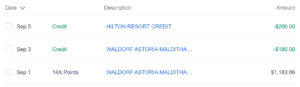 Screenshot of Amex Hilton Aspire Card transaction history showing resort credit posting