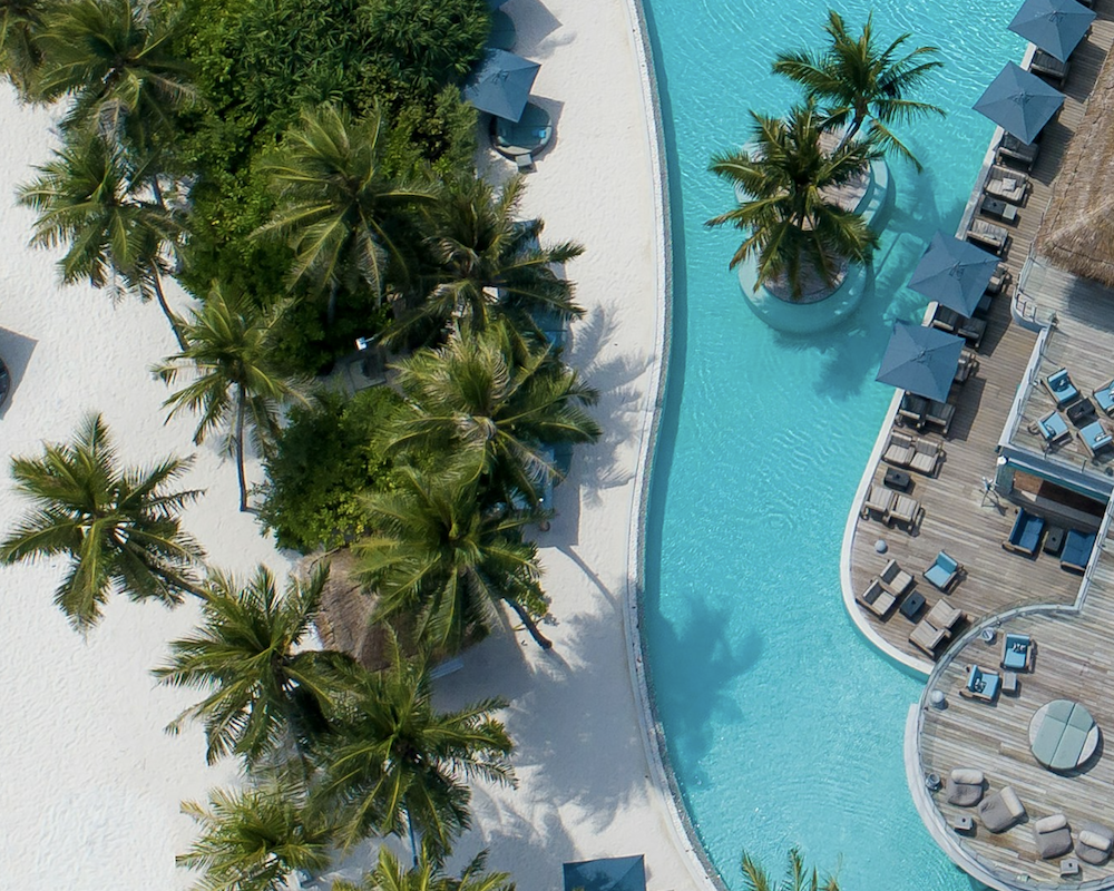 Aerial view of a blue-water resort.