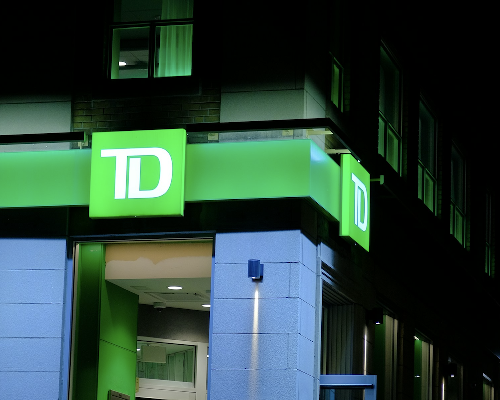 Exterior of TD Bank at night.