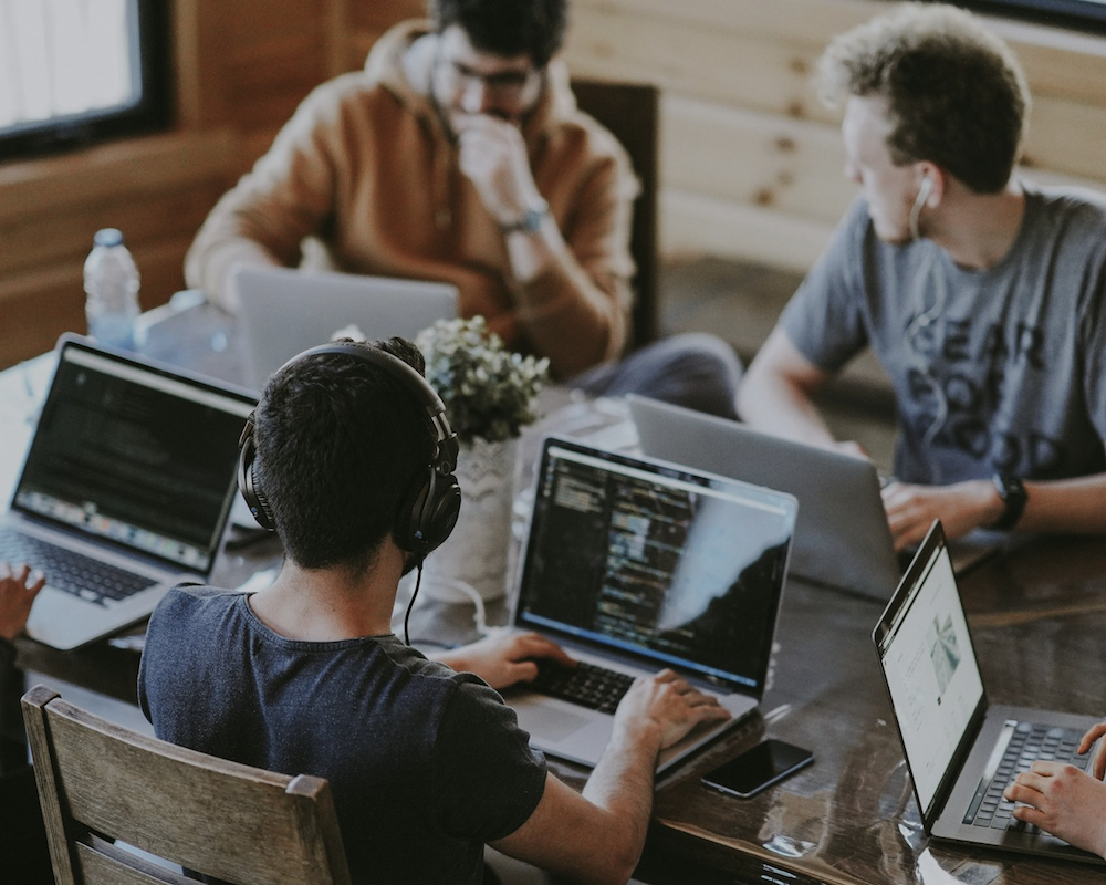 Overhead view of people working in a co-working space.