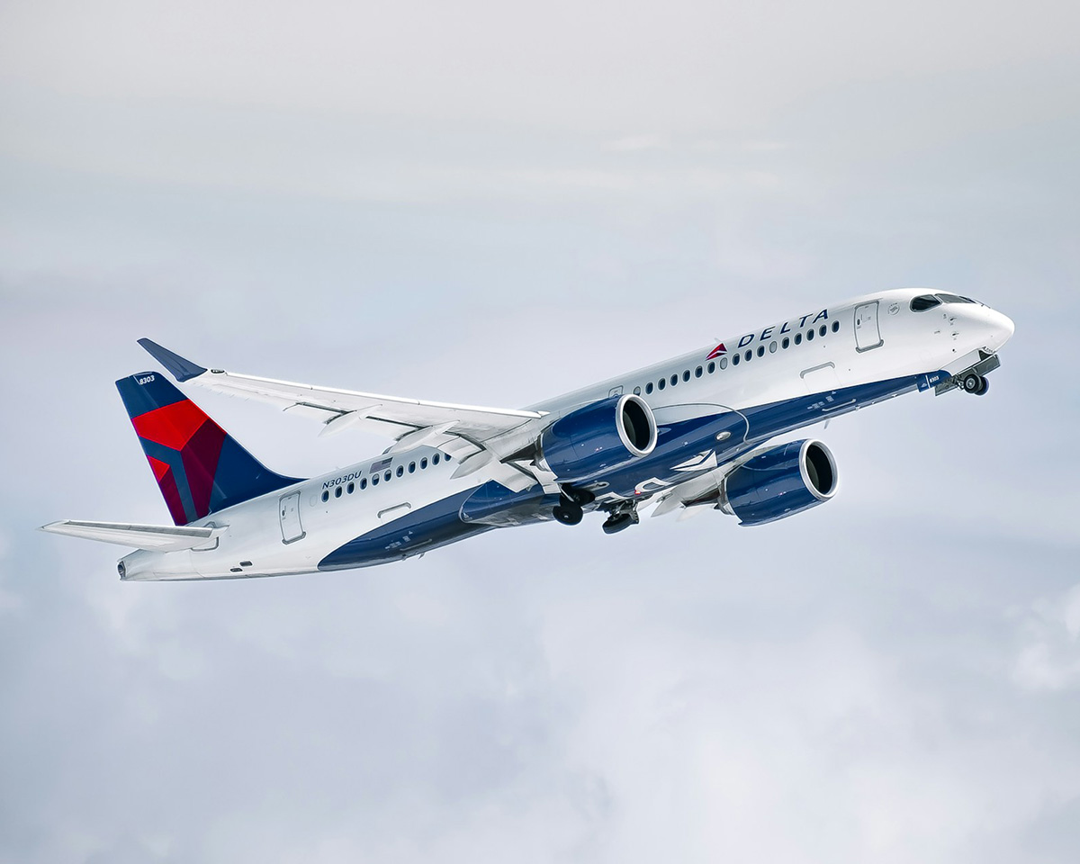 Delta Airlines widebody jet climbing after takeoff retracting gear