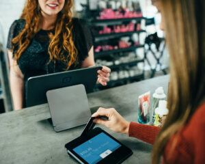 Woman paying for goods with a credit card