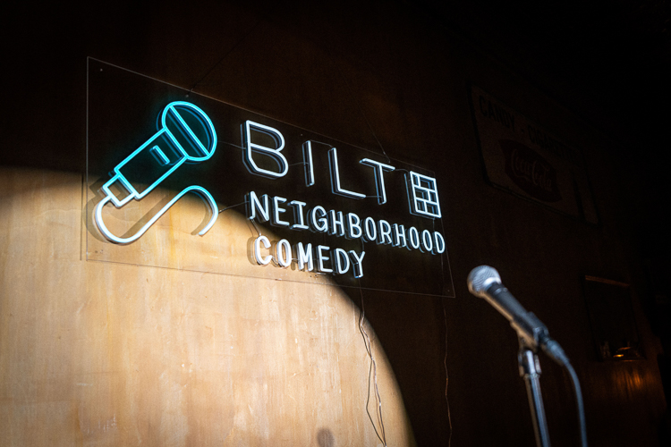 Photo of a stage with a Bilt Neighborhood Comedy sign