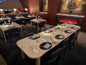 Delta One Lounge Boston dining room showing a table with seating for up to eight guests