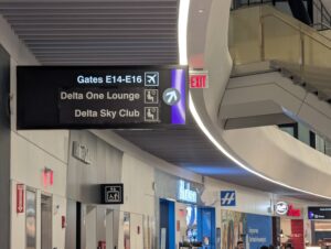 Delta One Lounge Boston terminal signage toward lounge