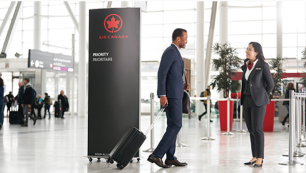 A photo shows an Air Canada Priority check in area