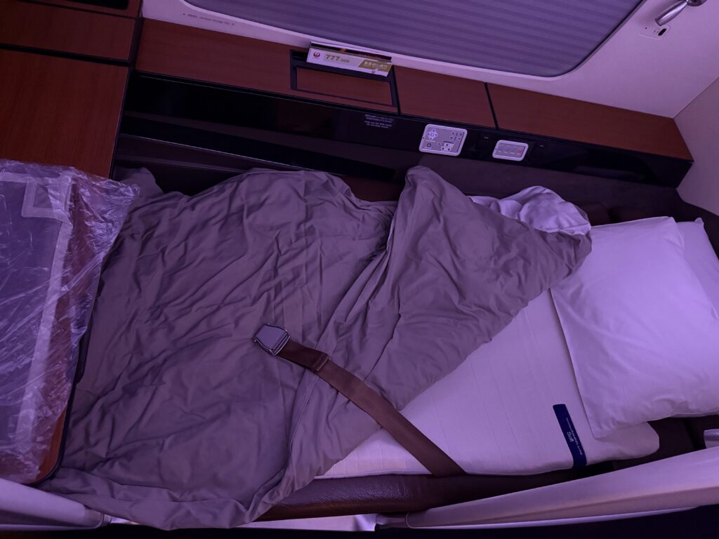 JAL First class seat converted to bed.