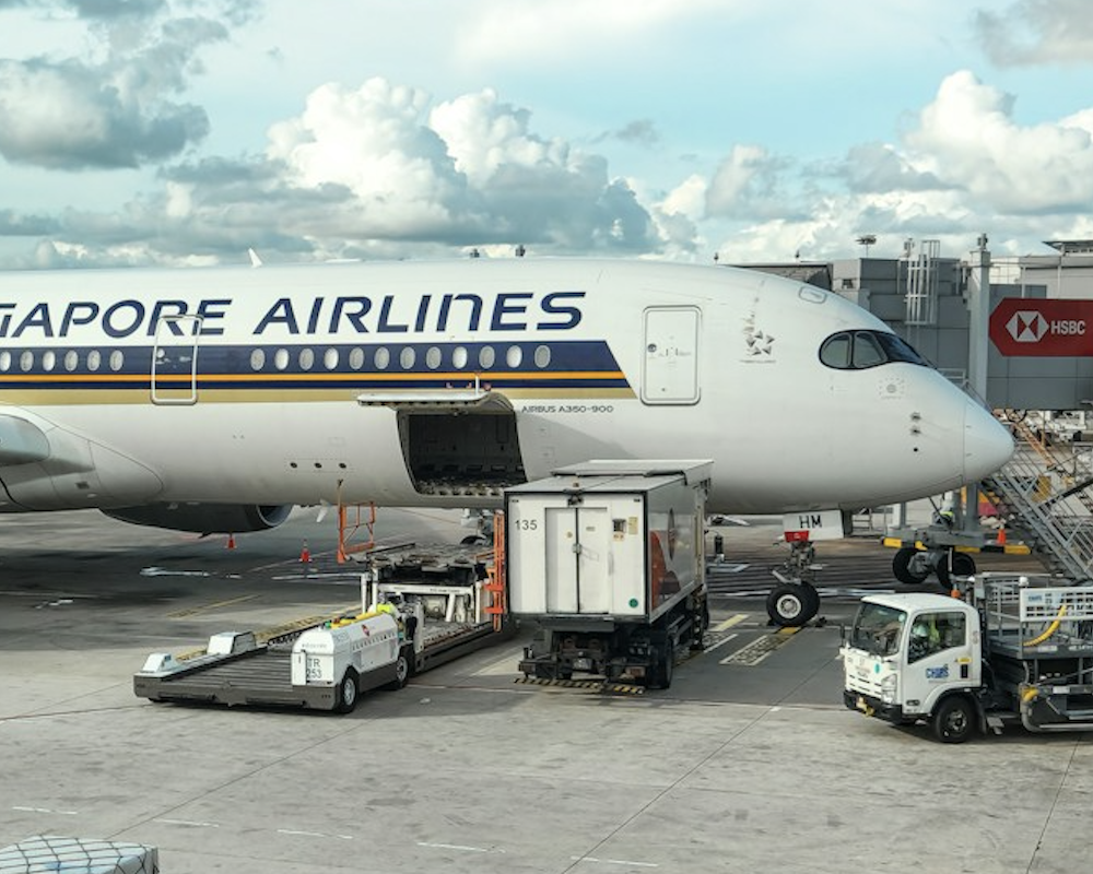 Singapore Airlines A350 at a gate.