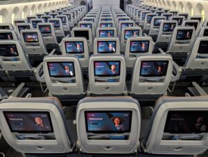 American Airlines 787-9P Main Cabin inflight entertainment screens viewed from the back of the cabin