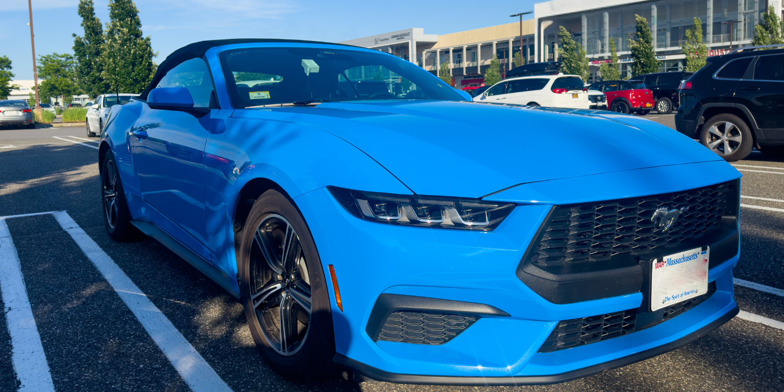 Blue Mustang convertible rented as a Hertz Gold Plus Rewards President's Circle member.
