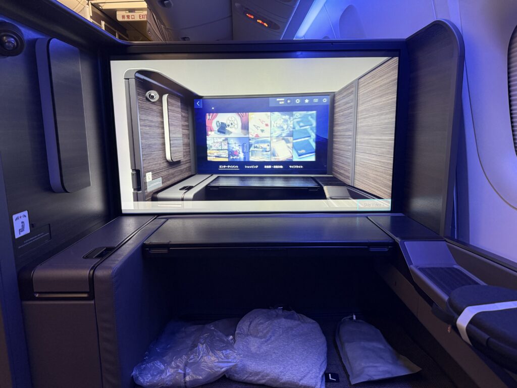 Photo of ANA The Suite first class seat 43-inch screen.