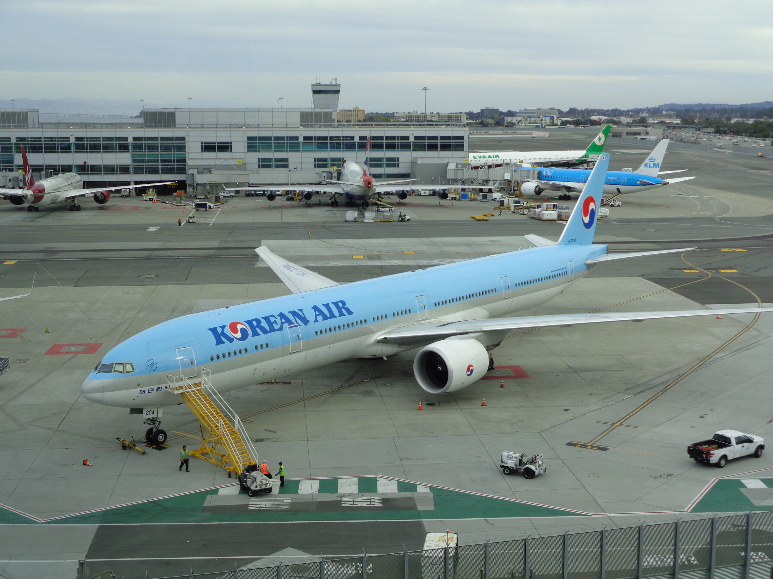 a Korean Air 777 parked at an airport