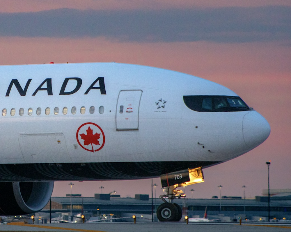 Air Canada 777 at YYZ around dusk.