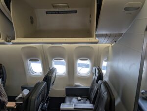 Photo of American Airlines premium economy overhead bin and seats